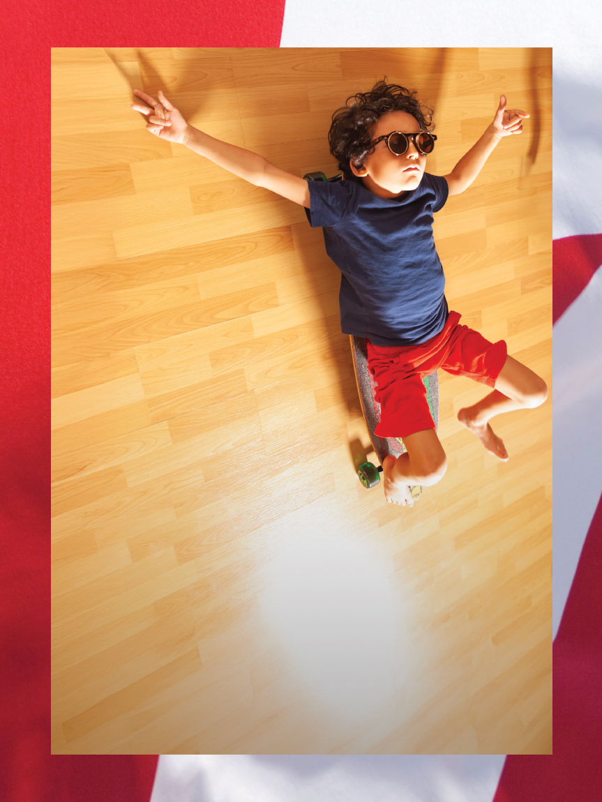Kids playing in rain boots on luxury vinyl flooring.
