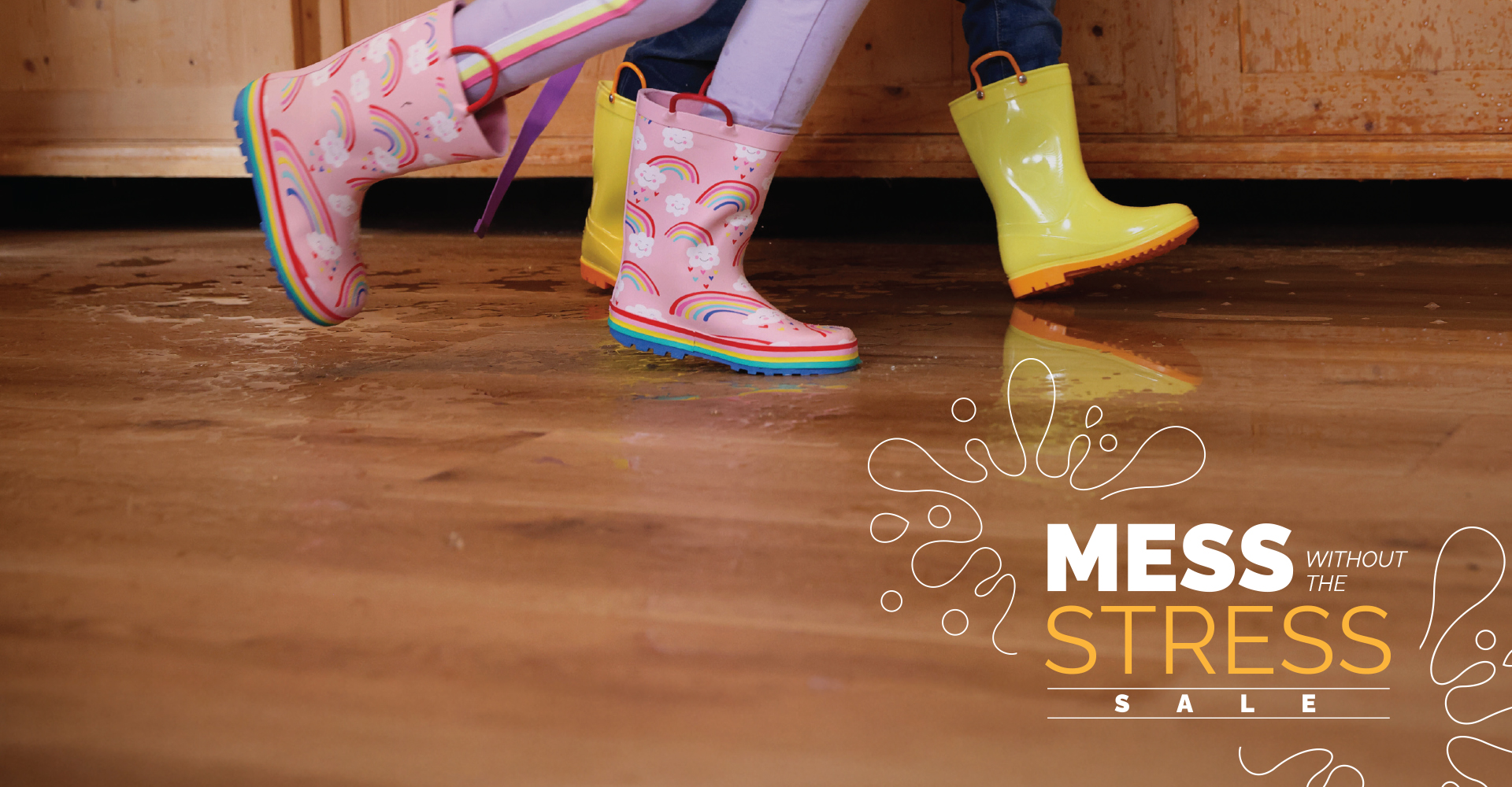 Kids playing in rain boots on luxury vinyl floor