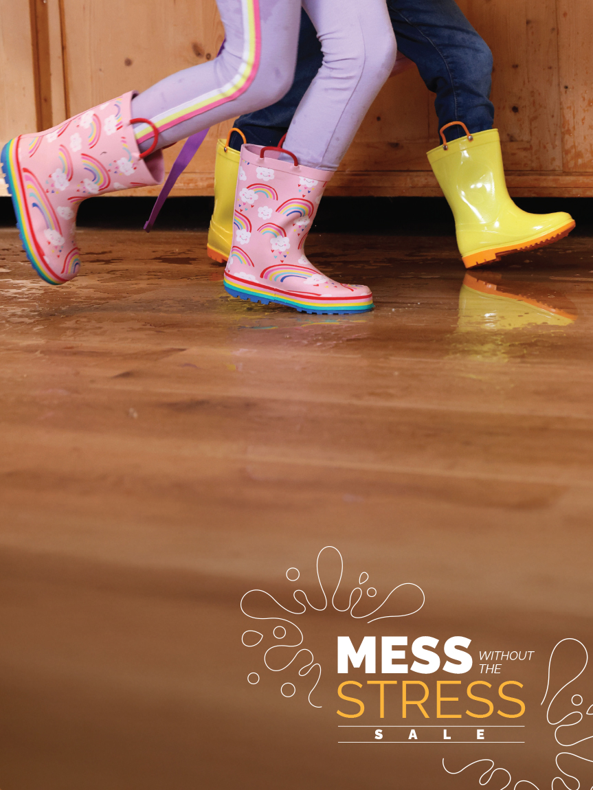 Kids playing in rain boots on luxury vinyl floor