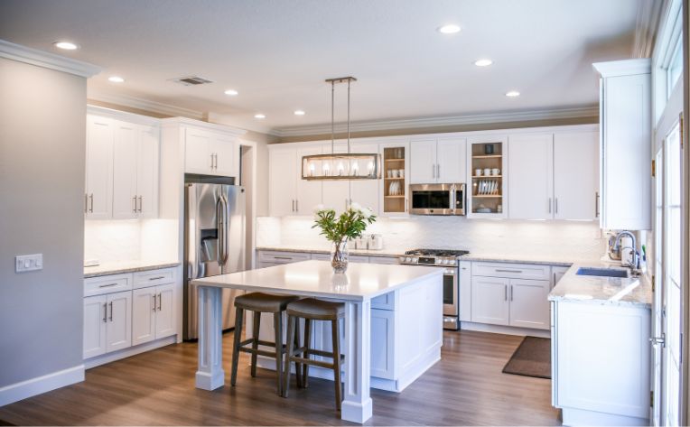 Open concept kitchen with dark hardwood floors