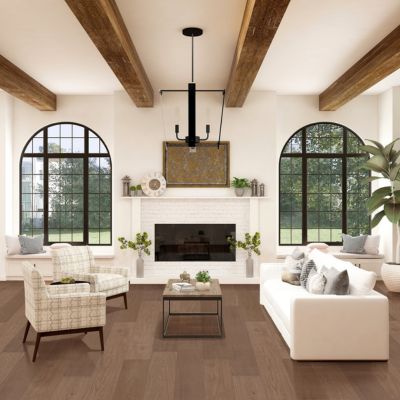 hardwood flooring in a rustic Charlottetown living room with fireplace and couches