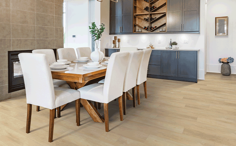light toned hardwood flooring in dining room with white chairs
